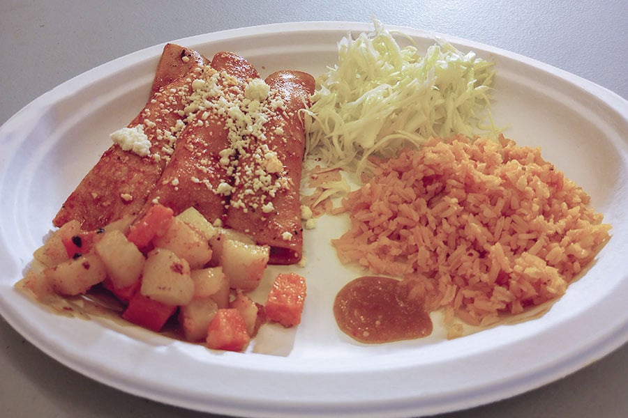 a plate with enchiladas and rice